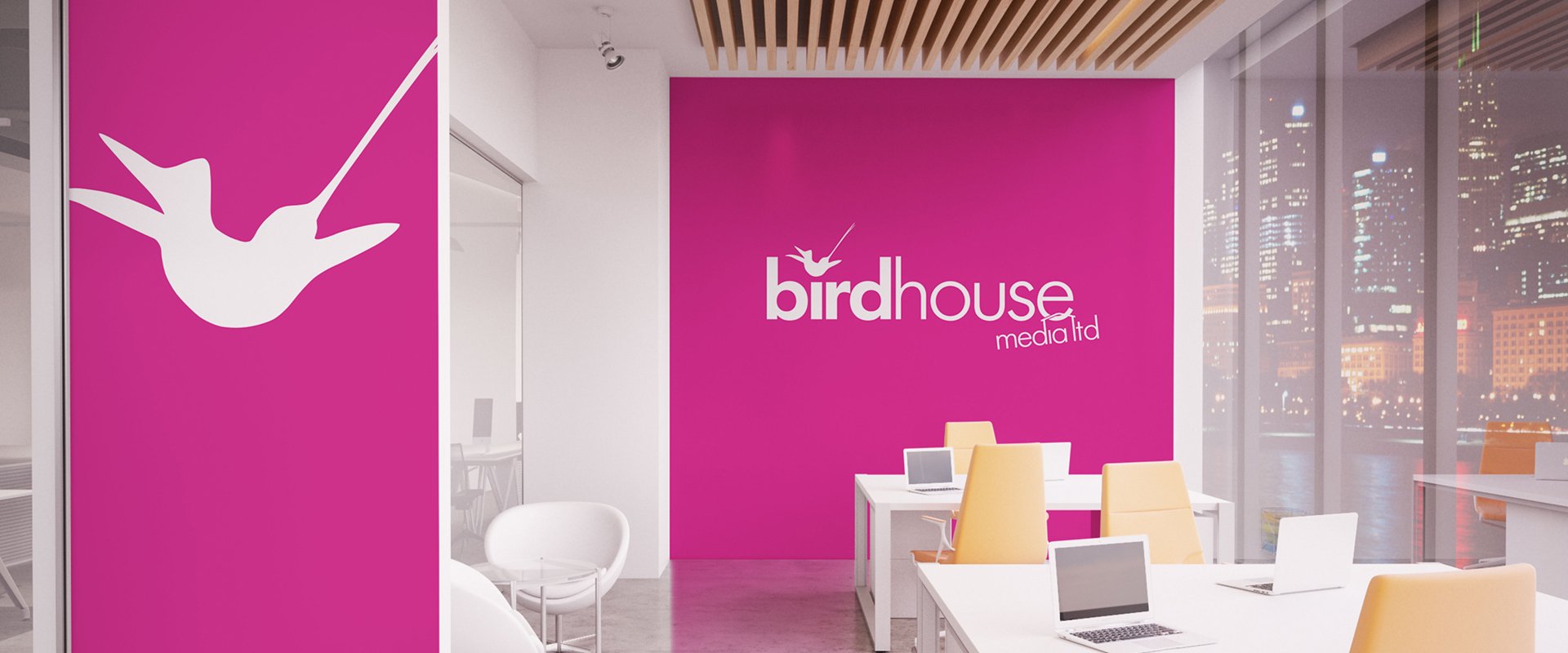 Branded office interior using pink from the companies logo for the walls, with white logo and logo icon on top.